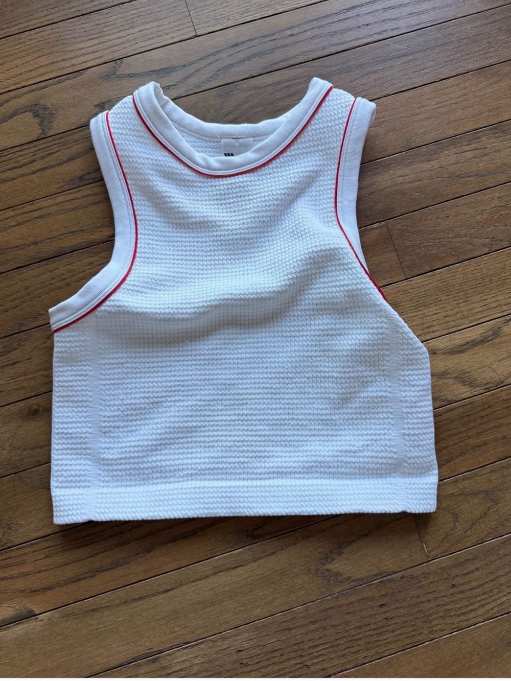 All in motion white tank top with red ribbing